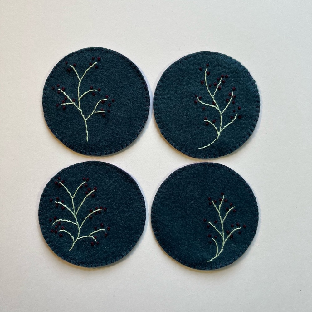 ‏Handcrafted felt coasters and embroidered.set of 4